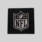 Black and white woven clothing label with custom design